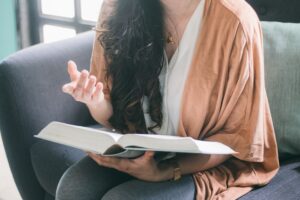 a woman with a book in her hand