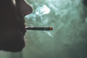 hypnotherapy for cannabis addiction, man smoking weed