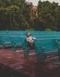 hypnotherapy for cannabis addiction, man sitting on park bench alone