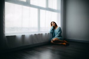 hypnotherapy for vaginismus treatment; a woman sitting by the window