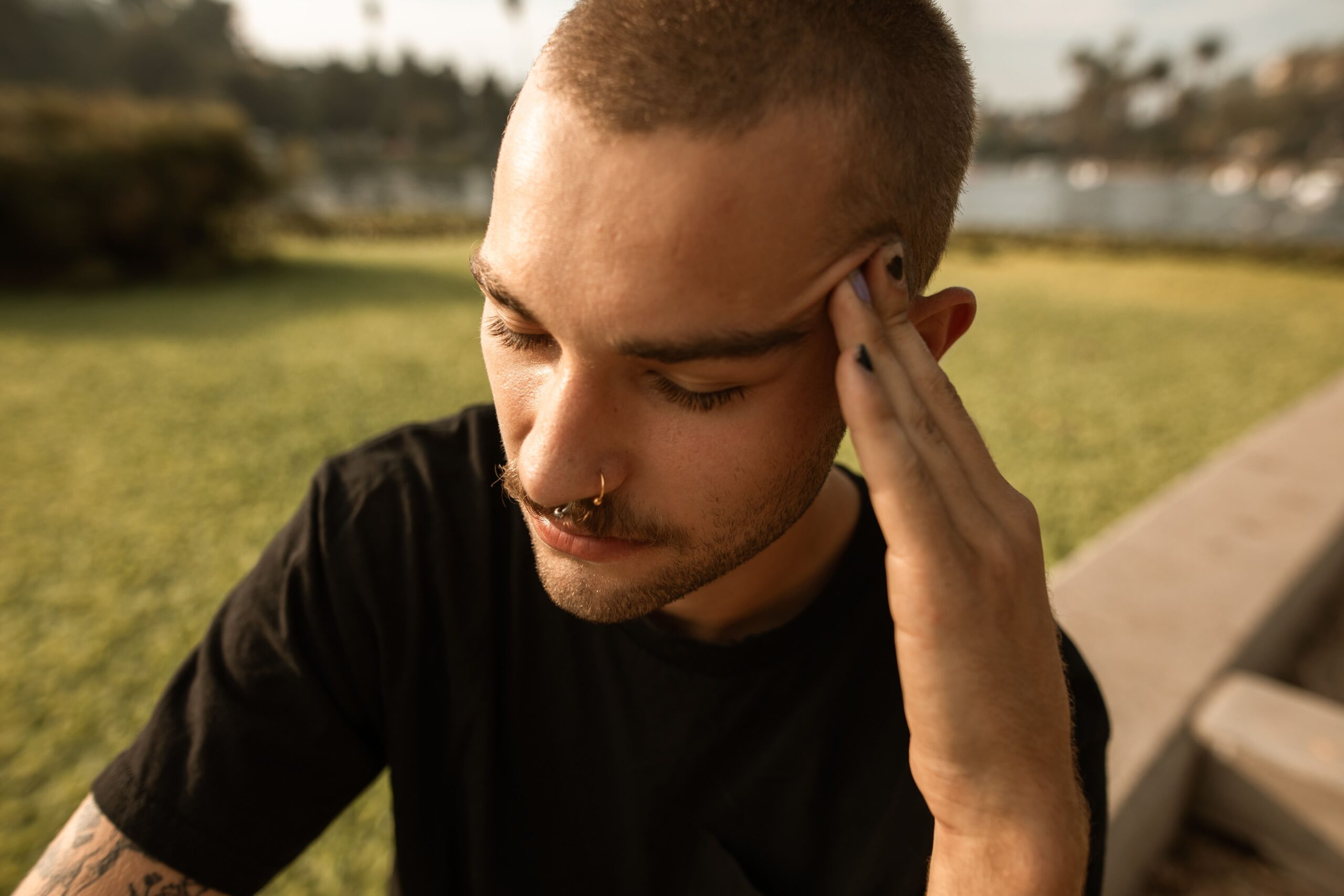 migraine hypnotherapy, man with hand on head