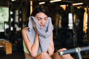 hyperhidrosis, a woman wiping her sweat