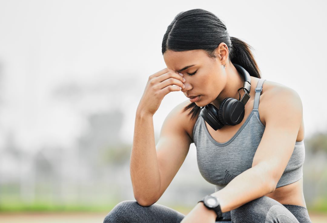 sports performance anxiety, a woman looking stressed