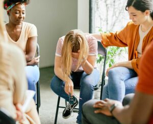 treating addiction, A woman feeling depressed due to addiction.